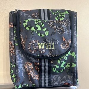 Potterybarn travel toiletry bag with “Will” embroidered on the front.